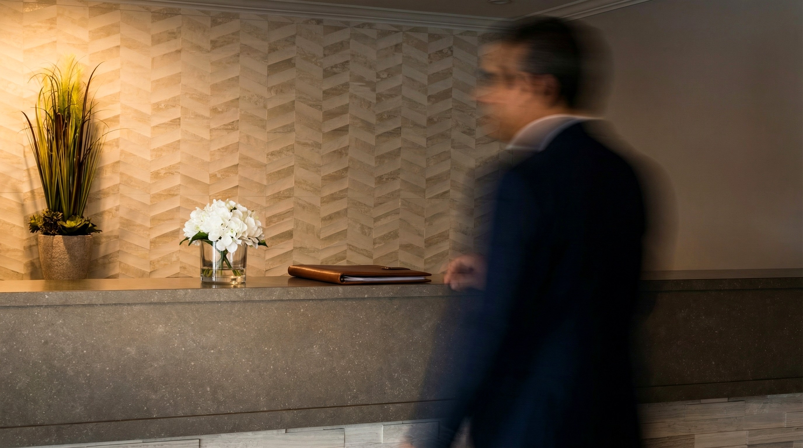 The front desk at Adam's Airport Inn — long exposure